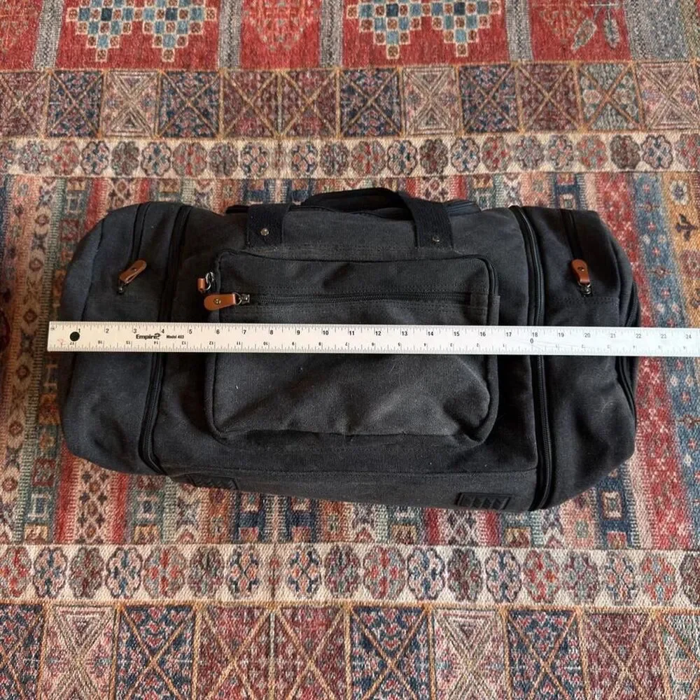 Sucipi Black canvas duffle bag with leather accents